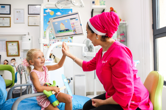 Dr Yasmin giving high five to Maria